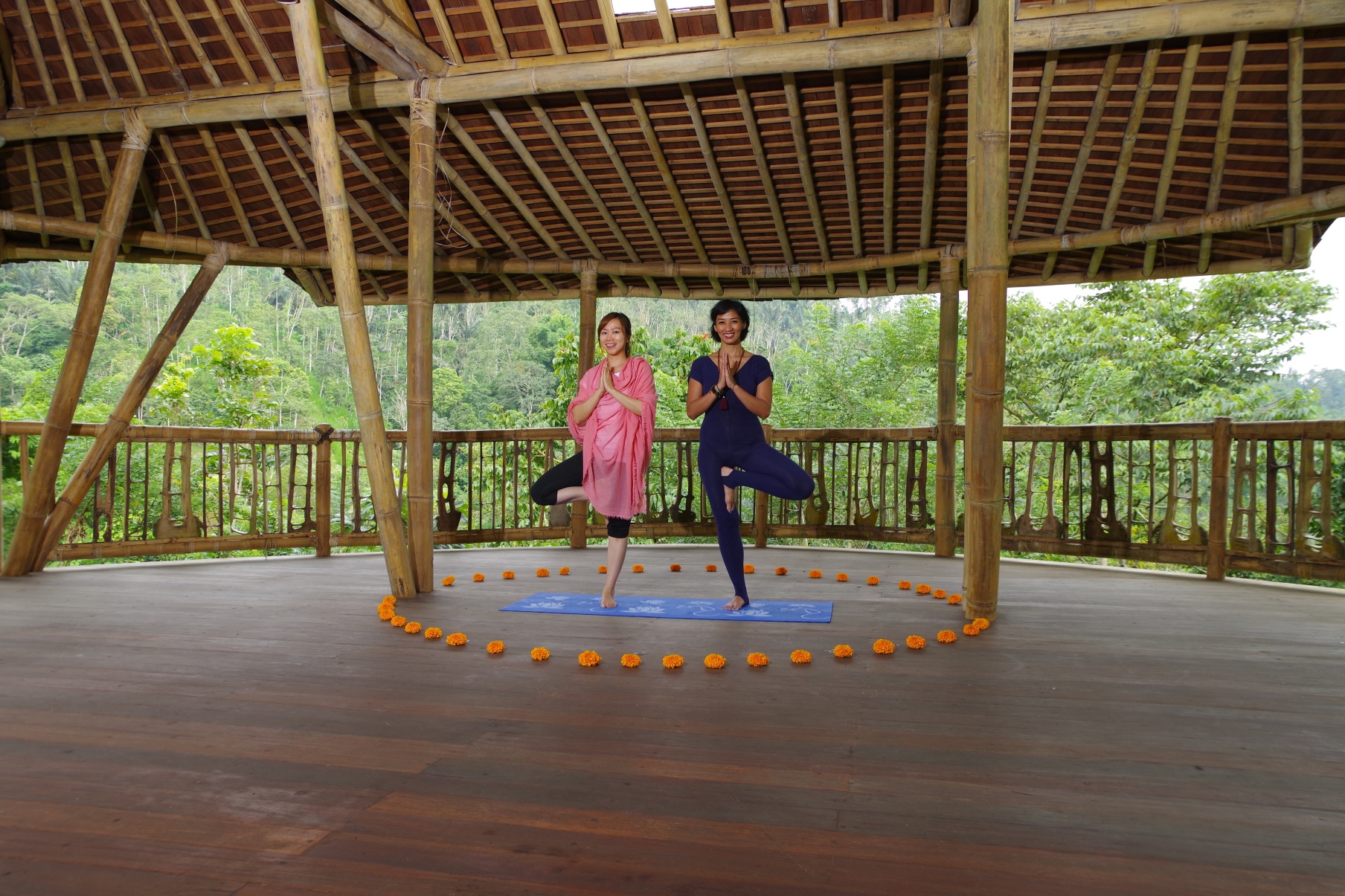 Photo of two people performing yoga